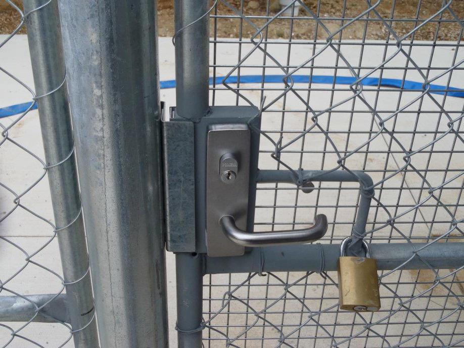 Commercial padlock on gate.
